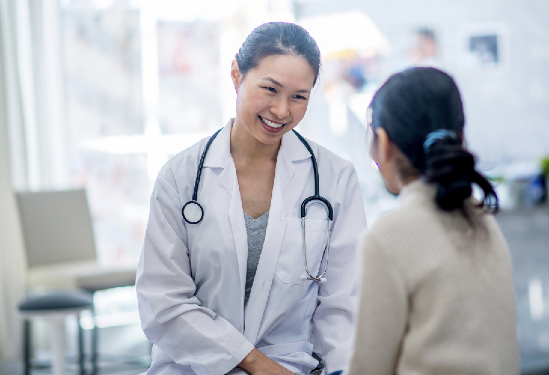 Woman talking with healthcare provider.